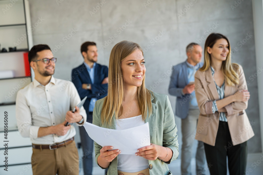 Group of business people and software developers working as a team in office