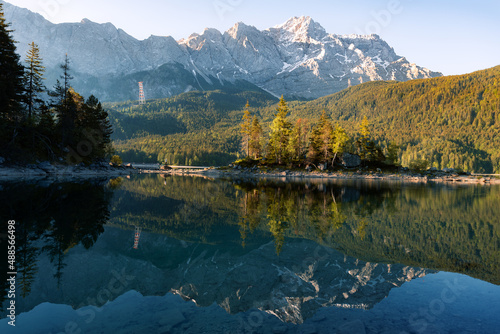 Impressive summer sunrise at Eibsee lake with Zugspitze mountain. Sunny outdoor scene in German Alps  Bavaria  Germany  Europe. Panorama Eibsee lake in the Alps. 