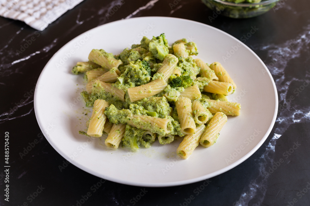 Creamy macaroni pasta with cheese and broccoli. Quick and easy vegetarian recipe.