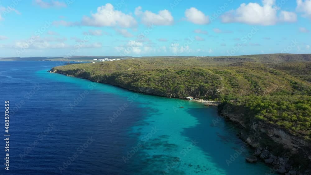 Aerial view of the coast of Curaçao in the Caribbean Sea with turquoise water, cliff, beach, and beautiful coral reef around Vaersenbay Aerial view of the coast of Curaçao in the Caribbean Sea with turquoise water, cliff, beach, and beautiful coral reef around Vaersenbay