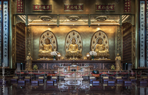 Bangkok, Thailand - Feb 19, 2022 : Architecture of Taiwanese temple-style and Three Buddha images inside Fo Guang San Temple. Selective focus.