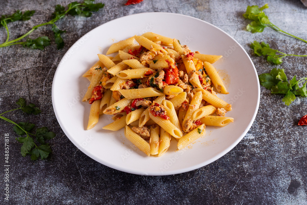 Penne with tuna and peppers. Easy and quick recipe typical of Mediterranean cuisine Penne with tuna and peppers. Easy and quick recipe typical of Mediterranean cuisine