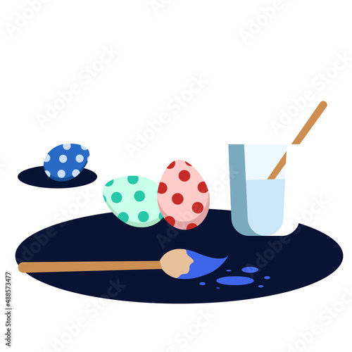 water and a brush with paint for decorating Easter eggs