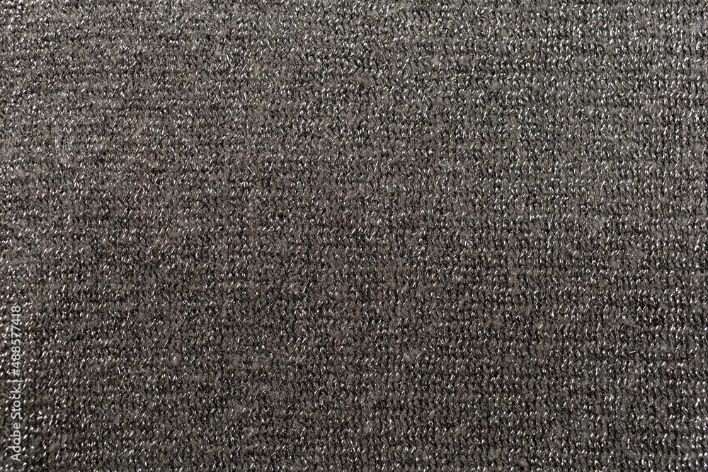 Dark gray knitted knitwear using shiny thread. Dark gray knitted knitwear using shiny thread.