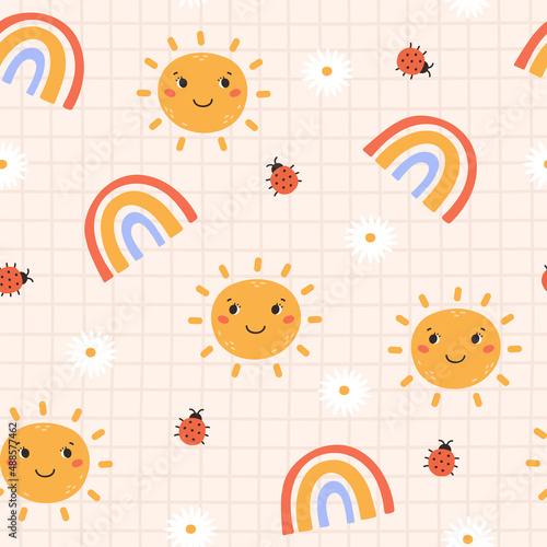 Cute childish seamless pattern with smiling sun, rainbow, ladybug and daisy on a checkered background. Cartoon vector illustration. Nursery Print for textiles and paper.