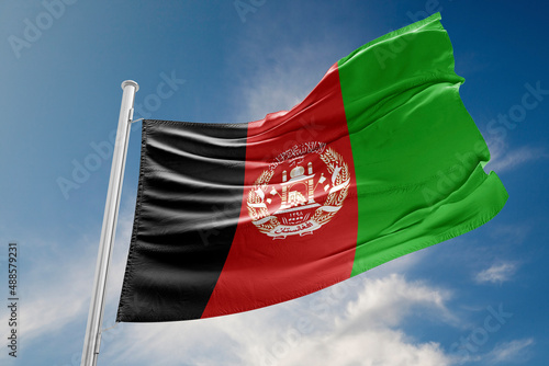 Afghan Flag is Waving Against Blue Sky