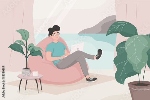 The guy is sitting in a beanbag chair and working on a laptop by the window overlooking the sea and mountains. Concept of home office, remote work, study, online conference. Flat cartoon vector.