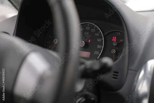 Dashboard and speedometer in the interior of the car close up