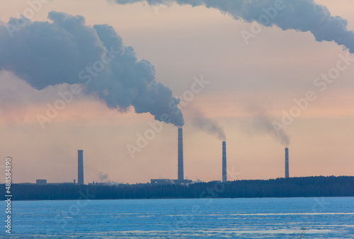 Smoke from the chimneys of a steel plant in winter