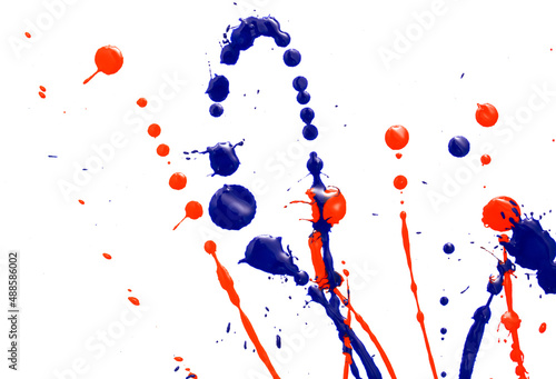 Drops of red and blue paint on a white background.