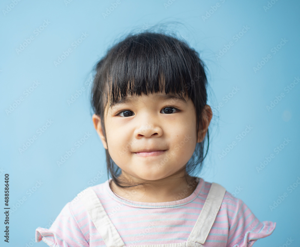 A headshot portrait of a cheerful baby Asian woman, a cute toddler little girl with adorable bangs hair, a child wearing a purple sweater smiling and looking to the camera. A headshot portrait of a cheerful baby Asian woman, a cute toddler little girl with adorable bangs hair, a child wearing a purple sweater smiling and looking to the camera.