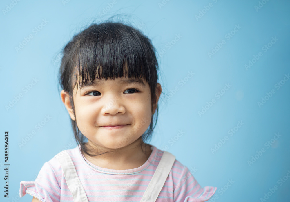 A headshot portrait of a cheerful baby Asian woman, a cute toddler little girl with adorable bangs hair, a child wearing a purple sweater smiling and don't looking to the camera. A headshot portrait of a cheerful baby Asian woman, a cute toddler little girl with adorable bangs hair, a child wearing a purple sweater smiling and don't looking to the camera.