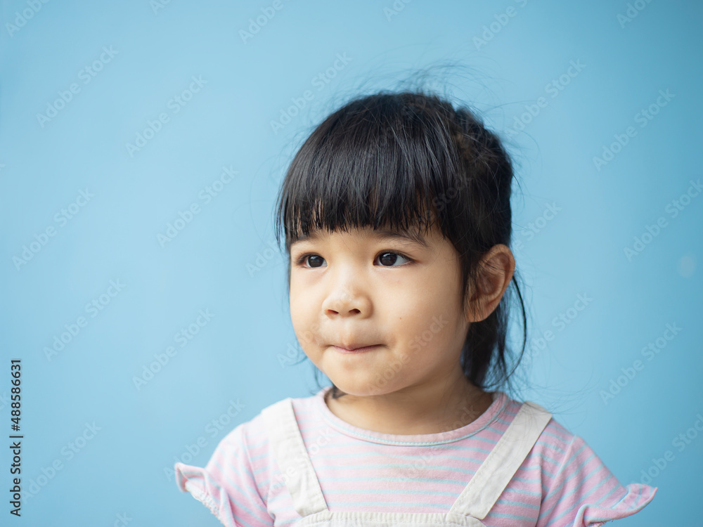 A headshot portrait of a cheerful baby Asian woman, a cute toddler little girl with adorable bangs hair, a child wearing a purple sweater smiling and don't looking to the camera. A headshot portrait of a cheerful baby Asian woman, a cute toddler little girl with adorable bangs hair, a child wearing a purple sweater smiling and don't looking to the camera.