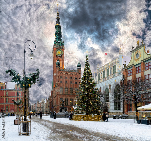 City Hall in Gdansk and winter snow-covered historic street 