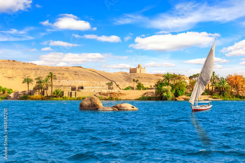 Sailboat in the Nile and the view of Aswan, Egypt