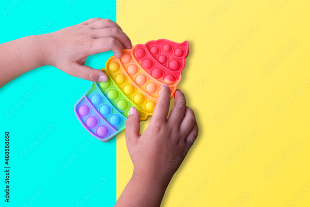 children playing with pop it fidget toys close up children playing with pop it fidget toys close up