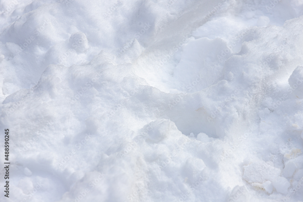 Fototapeta premium White fluffy snow on the ground floor with steps and dirty, Very fine surface, structure and curved texture of snow, Nature pattern background.