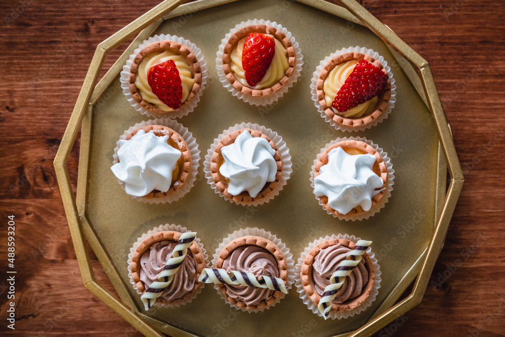 Bite size desserts on a golden plate Bite size desserts on a golden plate