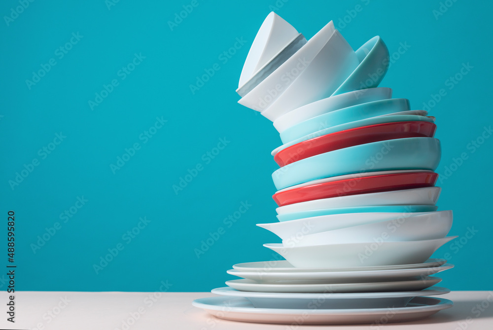 Unstable stack of dishes - obrazy, fototapety, plakaty 