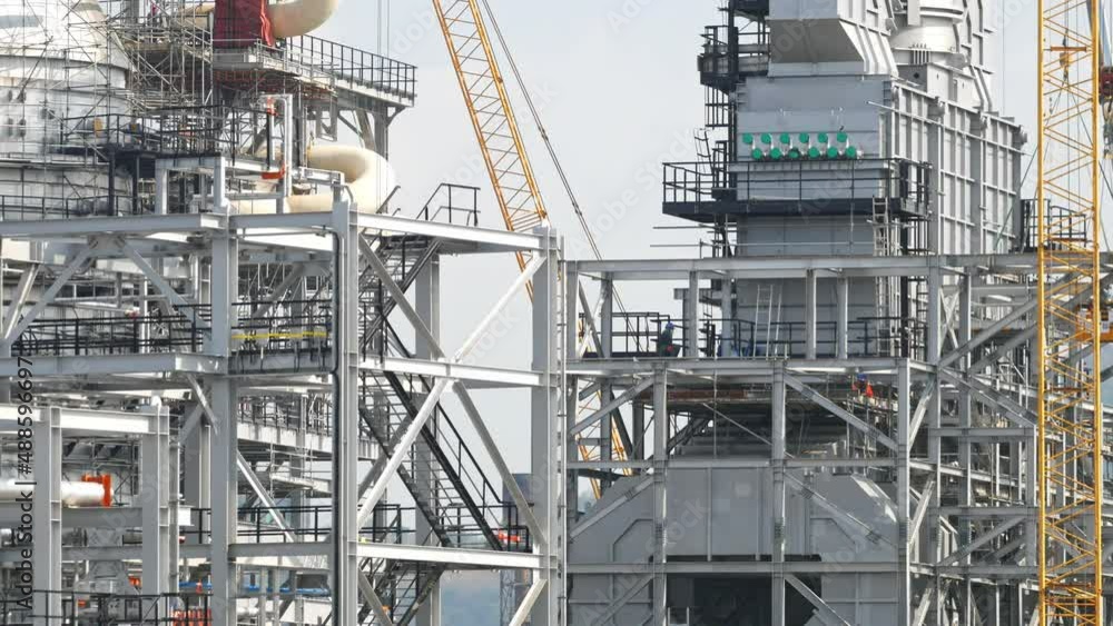 A large engineering structure of a chemical and oil refinery is currently under construction. A large engineering structure of a chemical and oil refinery is currently under construction.