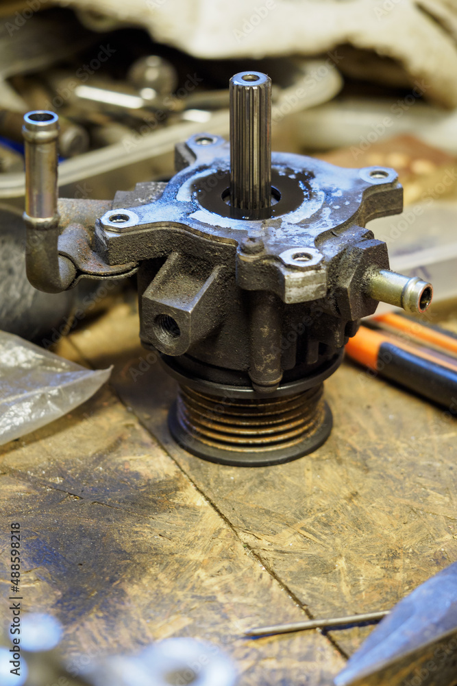 Removed part of the pump from the engine alternator. Removed part of the pump from the engine alternator.