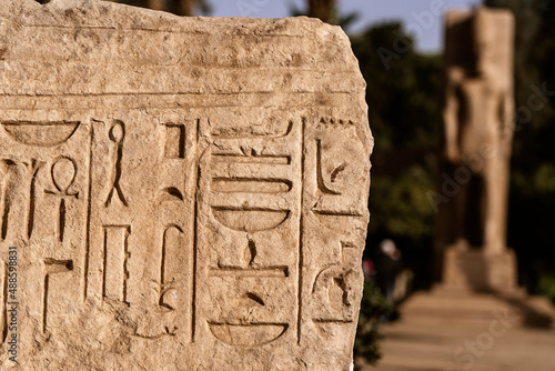 Old slab with Egyptian hieroglyphs photo