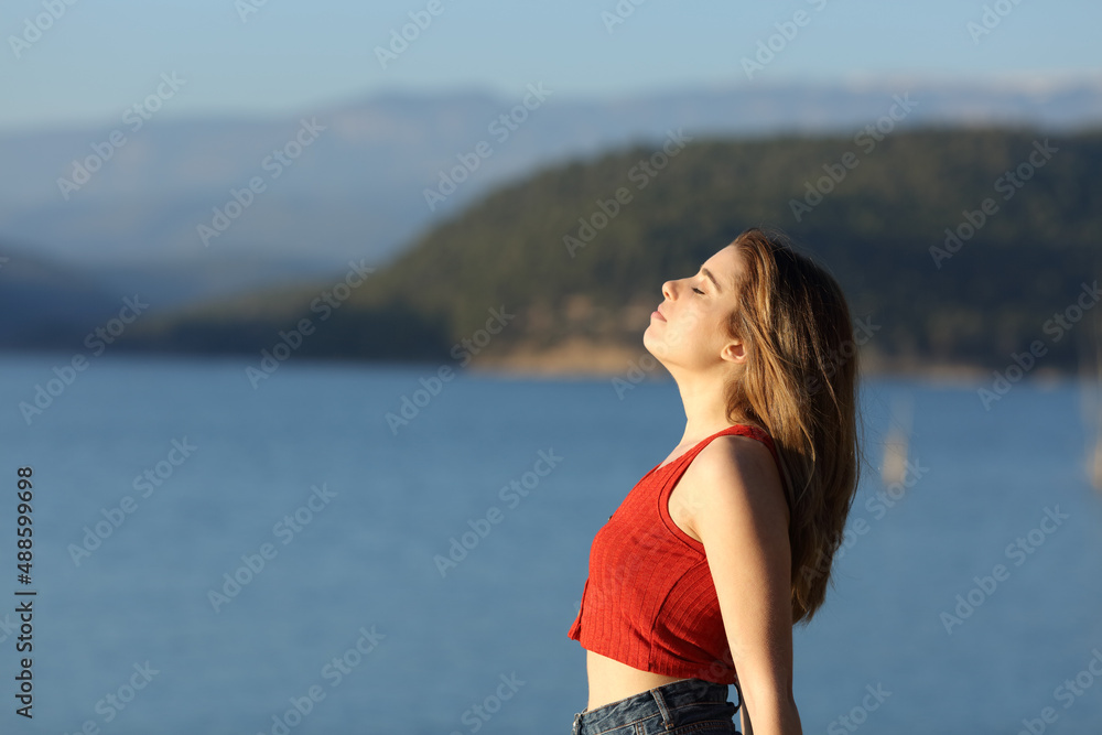 Teen is breathing fresh air in a lake Teen is breathing fresh air in a lake