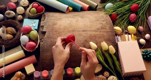 Easter eggs. Colored eggs. Video. Man hand. Holidays. Decoration. 