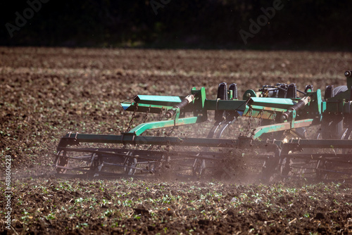 Versatile cultivator with disk, cultivate, harrow tools for secondary tillage - agricultural preparation of soil by mechanical agitation of various types, such as digging, stirring, and overturning. © Sodel Vladyslav