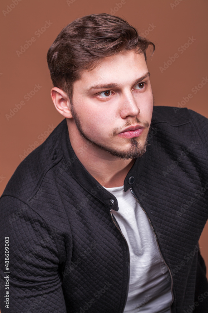 Fototapeta premium Portrait of a young guy with a beard