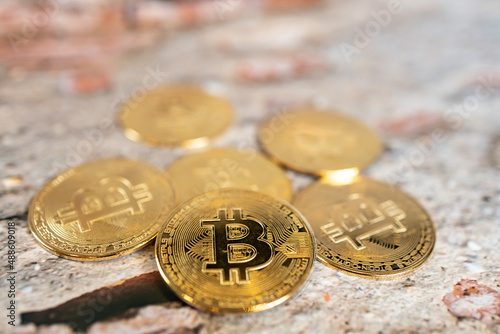 Close up one golden coin and silver coin with the bitcoin symbol and ethereum symbol.