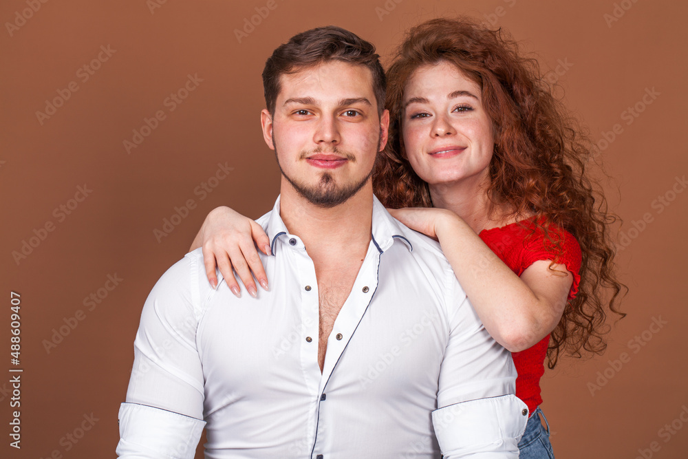 Beautiful red hair girl posing with her boyfriend Beautiful red hair girl posing with her boyfriend
