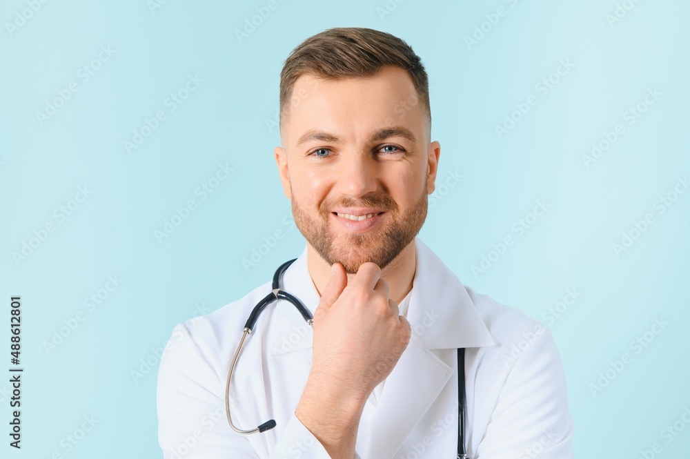 Horizontal banner of smiling young doctor ready to help patients with health problems, isolated on blue background with copy space. Horizontal banner of smiling young doctor ready to help patients with health problems, isolated on blue background with copy space.