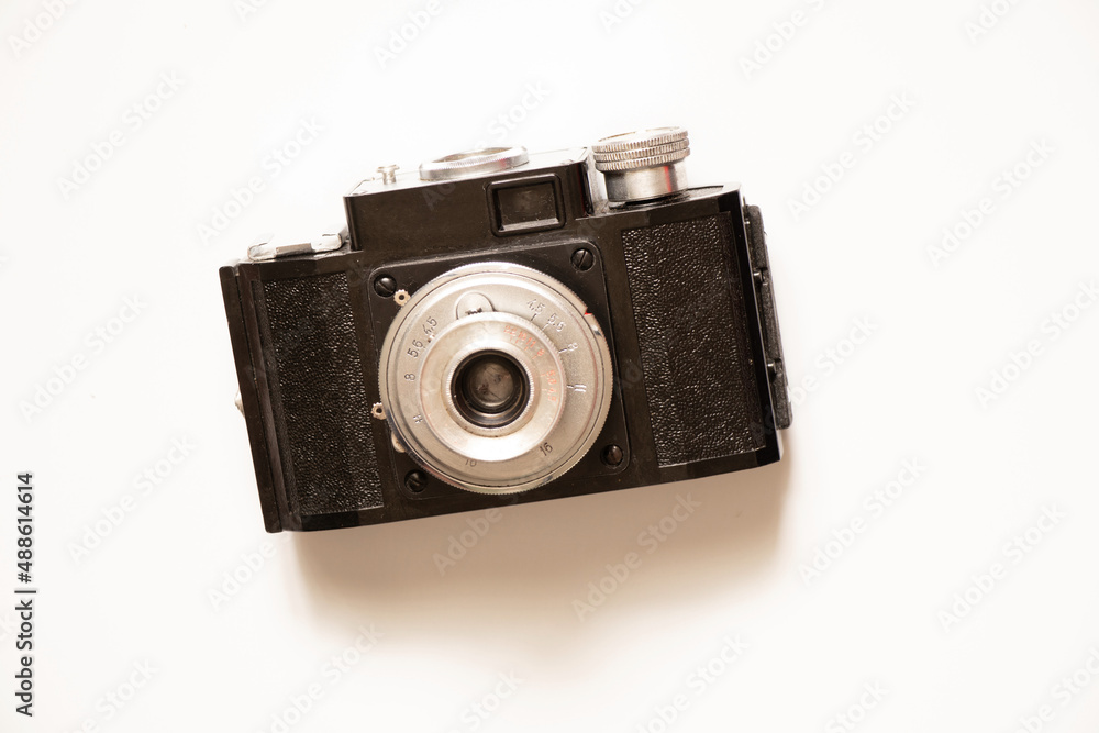 Old photo camera on a white background close up