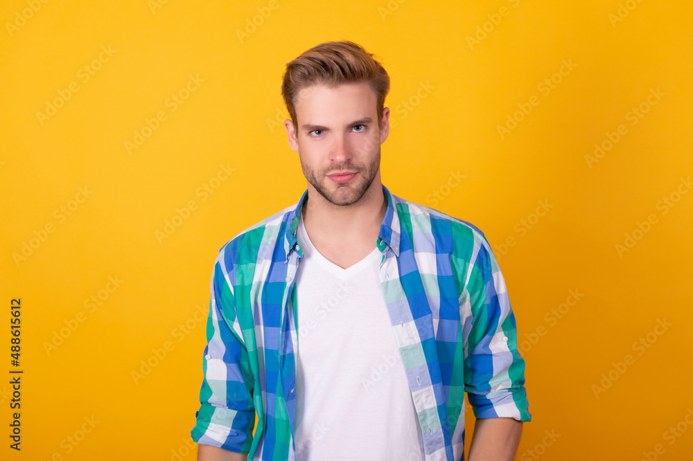 Seriously handsome. Regular guy portrait. Handsome guy yellow background. Young man
