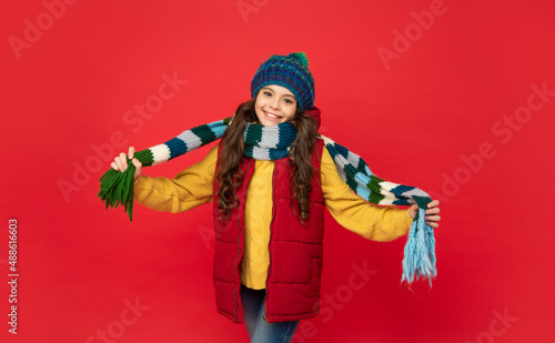 female fashion model. teen girl showing scarf. portrait of child wearing warm clothes.
