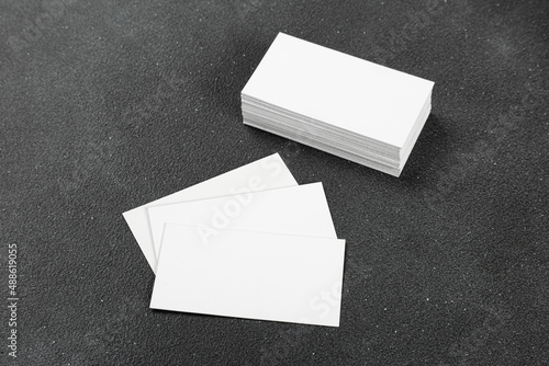 Photos of business cards. Mock-up for corporate identity on a black background. For graphic designers presentations and portfolios