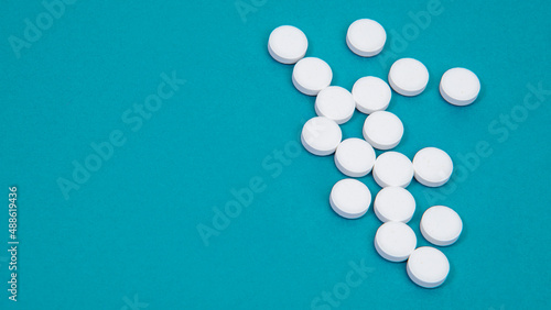 Medcine white pills aspirin pharmacy on blue background