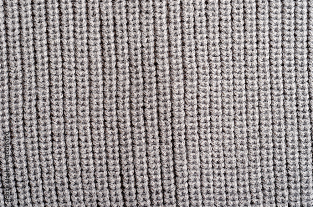 Knitted fabric. Texture close-up. Designer concept Knitted fabric. Texture close-up. Designer concept