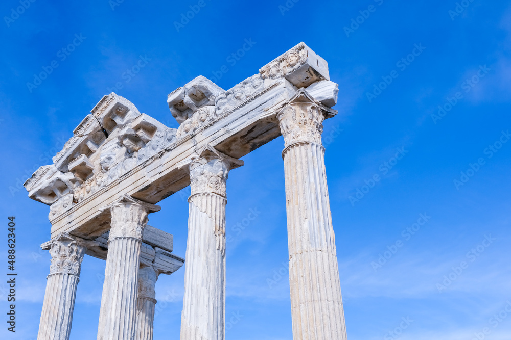 Temple of Apollo with blue sky background, Greek and Roman ancient historical antique marble columns in Side Antalya Turkey, close-up shot, copy space.