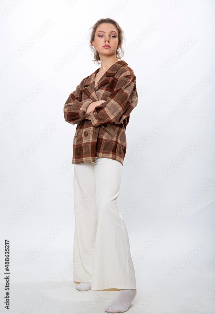 A girl poses with a brass musical instrument tuba A girl poses with a brass musical instrument tuba