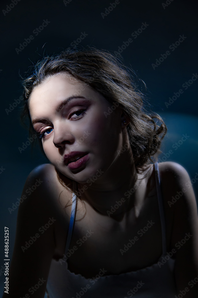 Studio portrait of a girl with an original light Studio portrait of a girl with an original light