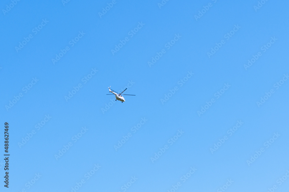 Helicopter against blue sky, copy space. Military theme Helicopter against blue sky, copy space. Military theme