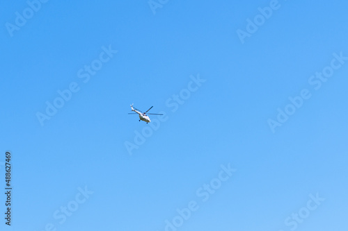 Helicopter against blue sky, copy space. Military theme