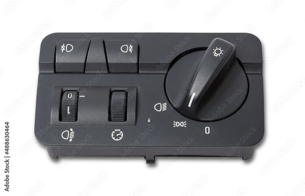 Close-up on the headlight switch control buttons and automatic adjust level dashboard of car in the vehicle repair workshop on white isolated background. Auto service industry Close-up on the headlight switch control buttons and automatic adjust level dashboard of car in the vehicle repair workshop on white isolated background. Auto service industry
