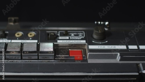 Finger presses the red rivers button and the play button at the same time: macro