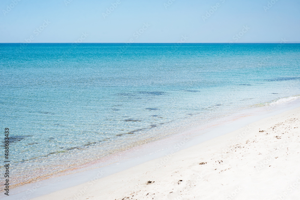 Seascape. Marine backgrounds. Turquoise sea and white sand and blue sky. Tourism. Holidays. Relax. SPA.
