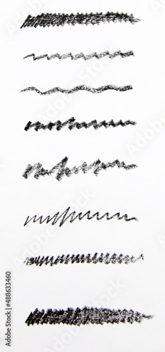Cosmetic pencil samples isolated on a white background Hand drawn hatching shapes on isolated white background. Wavy tangled doodles. Black and white illustration