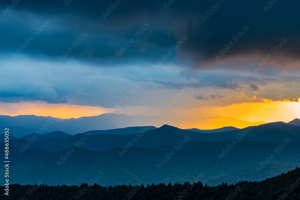 Summeer squall rainstorm and a dramatic sunset over the Blue Ridge Mountains