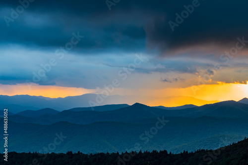 Summeer squall rainstorm and a dramatic sunset over the Blue Ridge Mountains photo